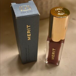 Merit lip oil in the lovely shade Pink Beet